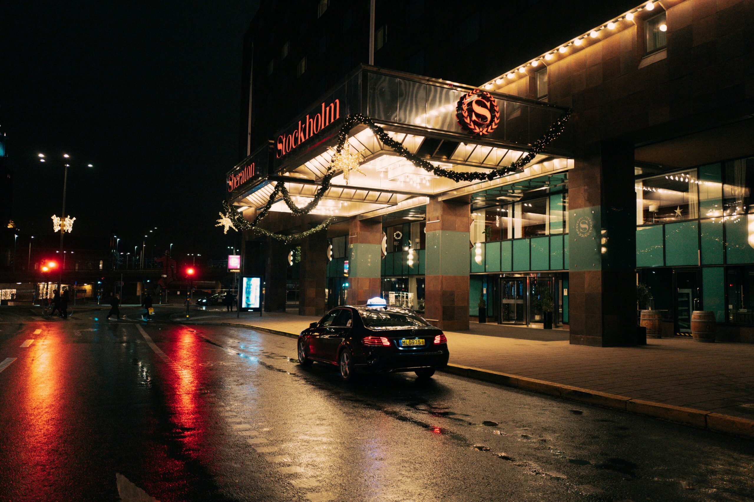 Stockholm taxi interior at night with city lights outside